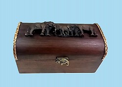 TB-23 R (Elephant ) 4'' x 8'' Wooden Turtle back  box with Resin Elephant on top. The tone of the wood and the style of  Resin will vary unless custom ordered .