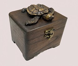 TB-27 R  Turtle ( also available with resin Elephant designs) Wooden Chest with Resin Turtle on top. The tone of the wood and the style of resin can vary -unless custom ordered .