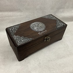 Item # TB-25 N    Hinged Lid wooden box with hand made metal pieces on the top and a latch on the front. The Metal designs as well as color and the texture of the wood can vary some.  4'' x 8'' in size