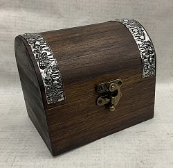 Item # TB-19 N  Small wooden  chest  with a round top and hinges is @ 9cm x 12cm in size. Accented with metal trim and a nice metal latch on the front. The design on the metal as well as the color and texture of the box can vary some.