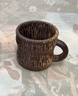 Item # PCS-4 A  plain style palm wood coffee cup.  The color and the texture of the wood can vary some.
