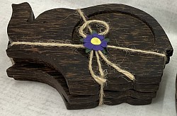 Item # CPE-1  Elephant Palmwood coaster set ( 4 pieces)  wrapped with string. - Color and texture of the wood can vary.