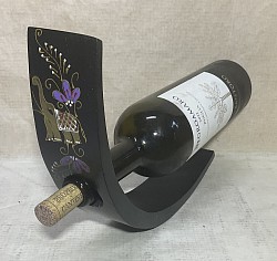 Item # MBH-P E ( elephant)  Mango wood wine bottle holder- This sample has dark brown paint base and a hand painted Elephant design. These can be ordered in different colors and designs