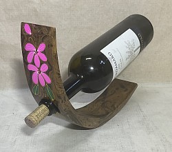 Item #  MBH-P F  ( Flower)  Mango wood wine bottle holder- This sample has a  brown and Black 